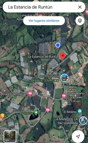 a map of a city with red and green pointers at La Estancia de Runtún Km 7 in Baños