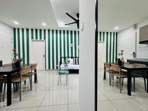 a dining room with green and white striped walls at The Sun 1 or 3BR Bayan Lepas 4 to 10 pax WL in Bayan Lepas