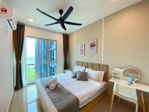 a bedroom with a large bed with a ceiling fan at JOVIAL Modern Cozy Suite `Metropol BM BandarPerda in Bukit Mertajam