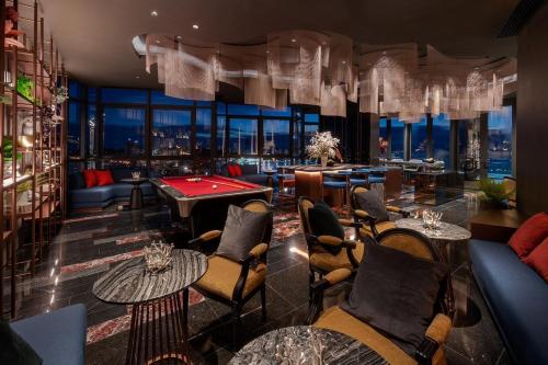 a restaurant with a pool table and a view at The Central Pattaya High Floor, Pattaya City in Pattaya Central