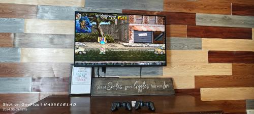 a sign on a wall with a picture of a house at Vintage Houze, fully aircond, Wi-fi, Netflix, Coway in Alor Setar