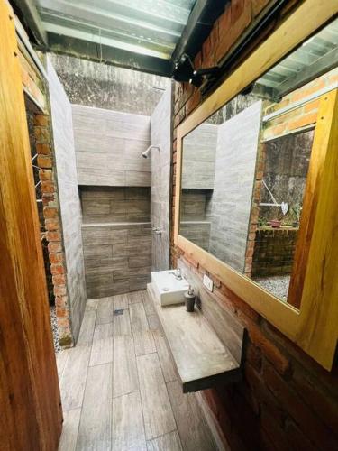 a bathroom with a sink and a mirror at Casa Sol Del Oriente Joaquín in Tena