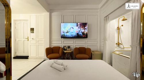 TV a/nebo společenská místnost v ubytování A In Hotel Glamour