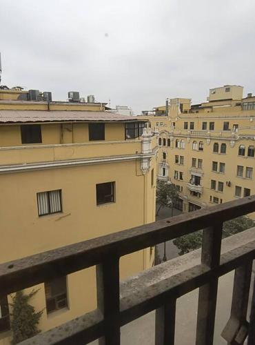 a view of a city from a balcony with buildings at Departamento frente a palacio gobierno in Lima