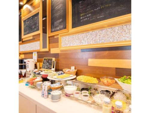 a kitchen with a counter with food on it at Hotel Terrace The Square Hitachi - Vacation STAY 17029v in Hitachi