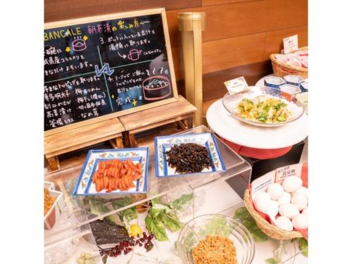 a buffet with food on a table with a chalkboard at Hotel Terrace The Square Hitachi - Vacation STAY 17001v in Hitachi
