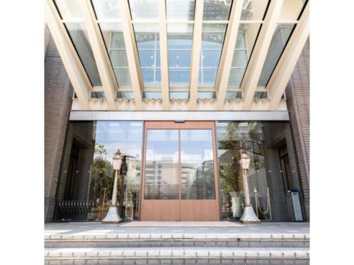 a front door of a building with a glass ceiling at Hotel Terrace The Square Hitachi - Vacation STAY 17029v in Hitachi
