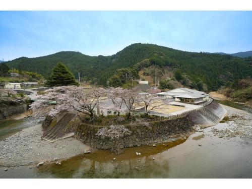 an aerial view of a house next to a river at Misato no Yu Kajikaso - Vacation STAY 22197v in Kimino