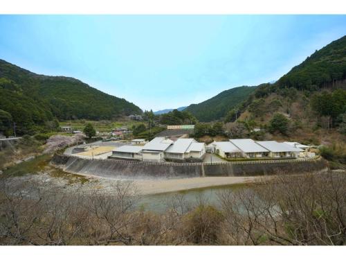 a group of buildings on the side of a river at Misato no Yu Kajikaso - Vacation STAY 22199v in Kimino