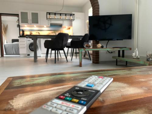 TV a/nebo společenská místnost v ubytování Work & Relax - Workation im Norden
