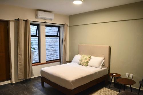 Кровать или кровати в номере Casa Palmas