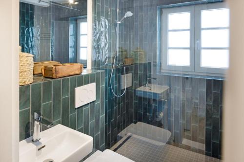 a bathroom with a toilet and a sink and a shower at Buhne 44 in List