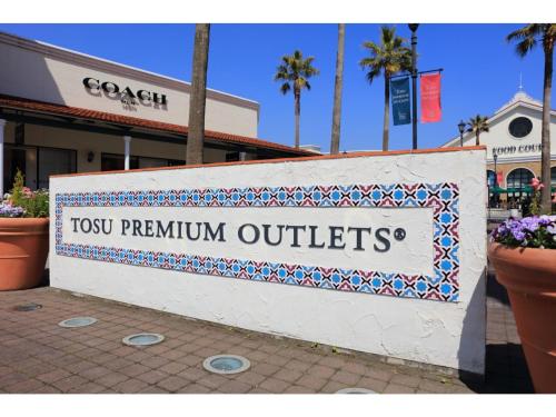 a sign that reads tyson premium outlets on a street at Sun Hotel Tosu Saga - Vacation STAY 49470v in Tosu