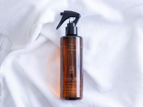 a brown bottle of soap sitting on a white towel at Sun Hotel Tosu Saga - Vacation STAY 49470v in Tosu
