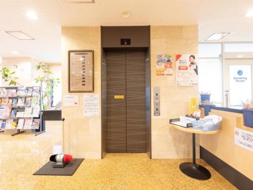 a elevator in a store with a door in it at Sun Hotel Tosu Saga - Vacation STAY 49470v in Tosu