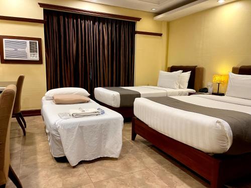 Postel nebo postele na pokoji v ubytování Hotel Del Rio