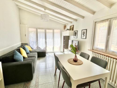 a living room with a couch and a table at Little house 2 bedrooms -Terrace, Antony Center near Paris and Orly in Antony