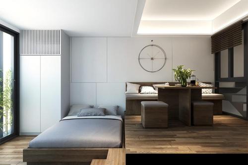 Postel nebo postele na pokoji v ubytování Susan House Saigon Serviced Apartments