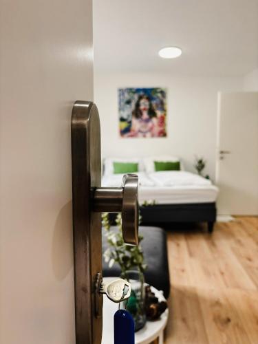 a door in a room with a bed in the background at Apartments nahe der Südsteirischen Weinstraße in Straß in Steiermark