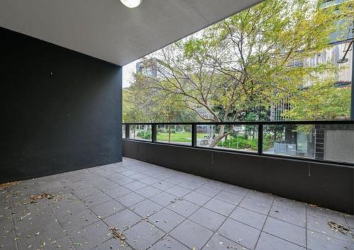 an empty room with a large window in a building at Docklands Serenity in Melbourne