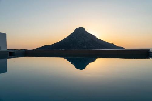 a mountain reflection in the water at sunset at Villa Katerina - Between sea & mountain in Kalymnos