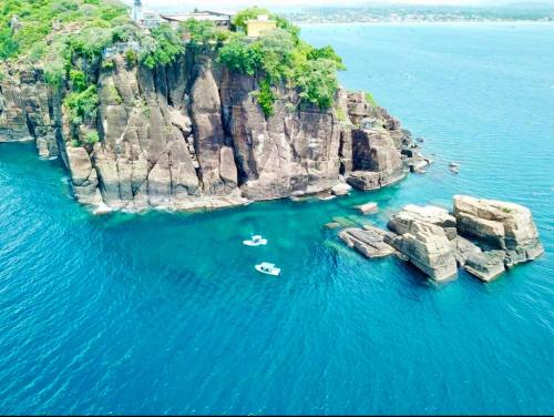 an aerial view of a rocky island in the water at Hema Holiday Villa in Trincomalee