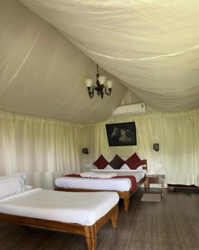Ένα ή περισσότερα κρεβάτια σε δωμάτιο στο Wilderness Jungle Camp