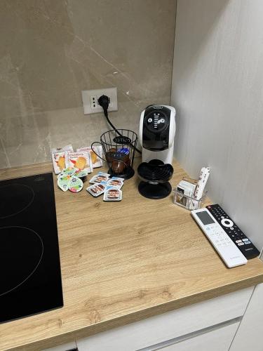 a counter top with a coffee maker and a toaster at Therma Luxury house in Termoli