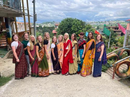 a group of women are posing for a picture at Hamro Family Ghar Apartment or Room near Kathmandu in Kathmandu