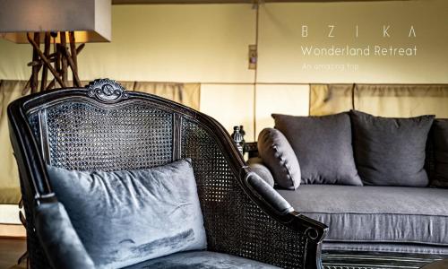 a wicker chair sitting in front of a couch at BZIKA Wonderland Retreat--Zhangjiajie National Forest Park Store in Zhangjiajie
