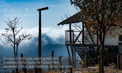 a street light next to a building with a tree at BZIKA Wonderland Retreat--Zhangjiajie National Forest Park Store in Zhangjiajie