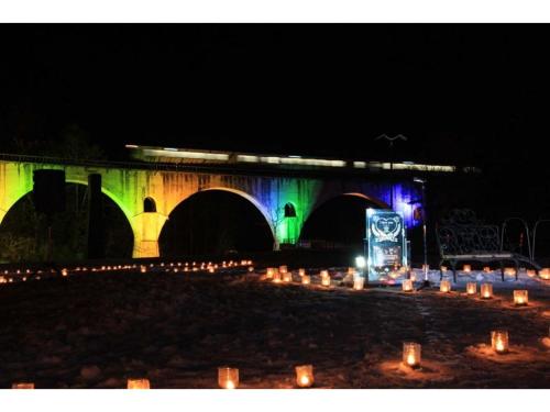 a bridge at night with candles and a train at Aeria Tohno - Vacation STAY 62231v in Tōno