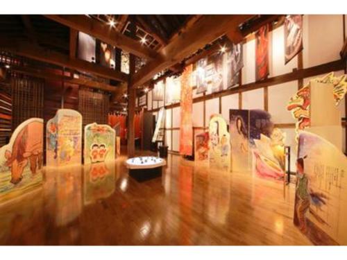 a large room with many pictures on the wall at Aeria Tohno - Vacation STAY 62231v in Tōno