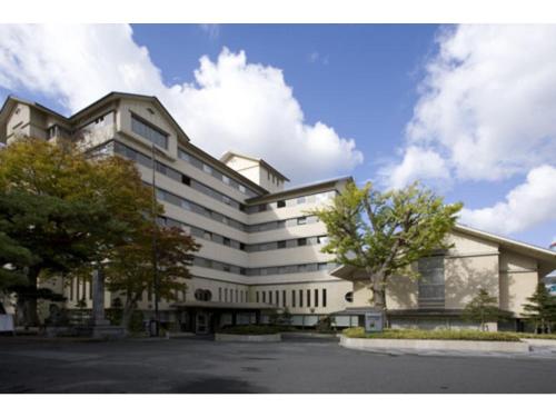 a large white building with trees in front of it at Aeria Tohno - Vacation STAY 62232v in Tōno