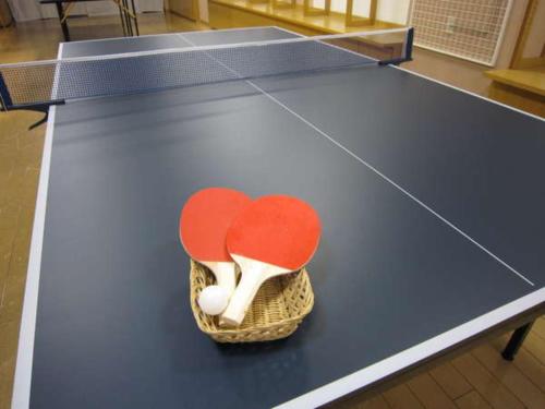 a ping pong table with two hearts in a basket at Mount View Hotel - Vacation STAY 40129v in Kamikawa