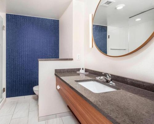 a bathroom with a sink and a mirror at Fairfield Inn & Suites by Marriott Lebanon in Lebanon