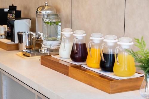 a counter with four bottles of orange juice and other beverages at Akihabara Washington Hotel in Tokyo