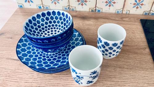 a group of blue and white plates and cups on a table at Četnická Stanice Mšeno in Mšeno