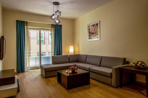 Coin salon dans l'établissement TIME Ruby Hotel Apartment