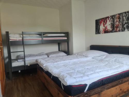 Ένα ή περισσότερα κρεβάτια σε δωμάτιο στο Ferienhaus Rose App 1