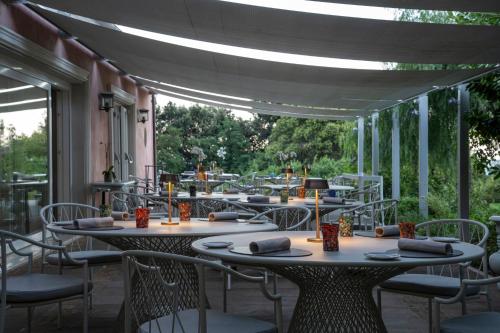 a patio with tables and chairs on a patio at Villa Lattanzi in Marina Palmense