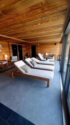 a room with a bunch of beds in it at MAD Retreat Hotel in Nendaz