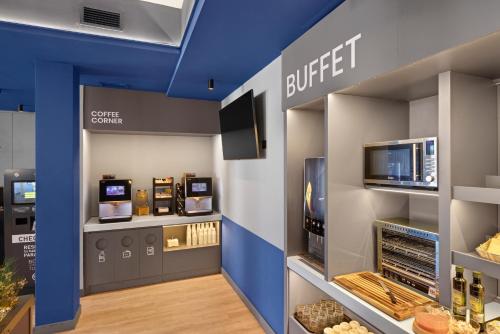 a store with a buffet with a buffetknifeknife at B&B HOTEL Girona 2 in Salt
