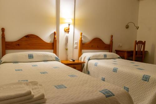 Postel nebo postele na pokoji v ubytování Hotel Philadelfia