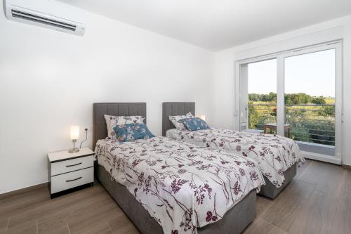 Ένα ή περισσότερα κρεβάτια σε δωμάτιο στο ARIEL A4, quiet area only 2 Km from the beach