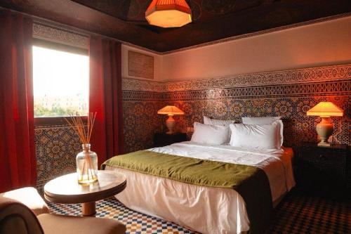 a bedroom with a large bed in a room at LUXURY apartment in Marrakesh