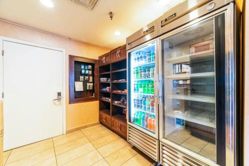 a kitchen with an open refrigerator with drinks in it at Metro PHX 1bd Exterior Entry with heated pool, bbq, dog park, bbq PETS ALLOWED in Phoenix