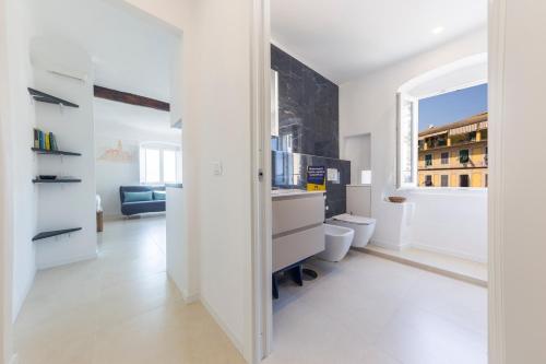 a white room with a desk and a window at CasaViva - Elegant Seaview Studio in Camogli in Camogli