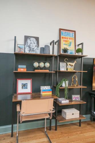 an office with a desk and a book shelf at Broadway Penthouse Above Live Music & Bars in Nashville