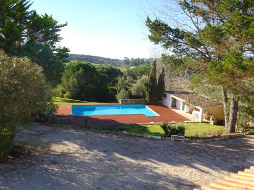 an image of a villa with a swimming pool at Casa das Xaras in Sintra